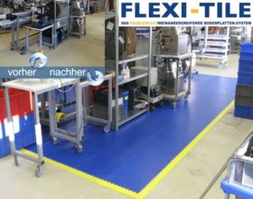 Flexi-Tile PVC Fliesen Arbeitsplatzboden Beispielanwendung in Dunkelblau mit gelben Rampen und Ecken